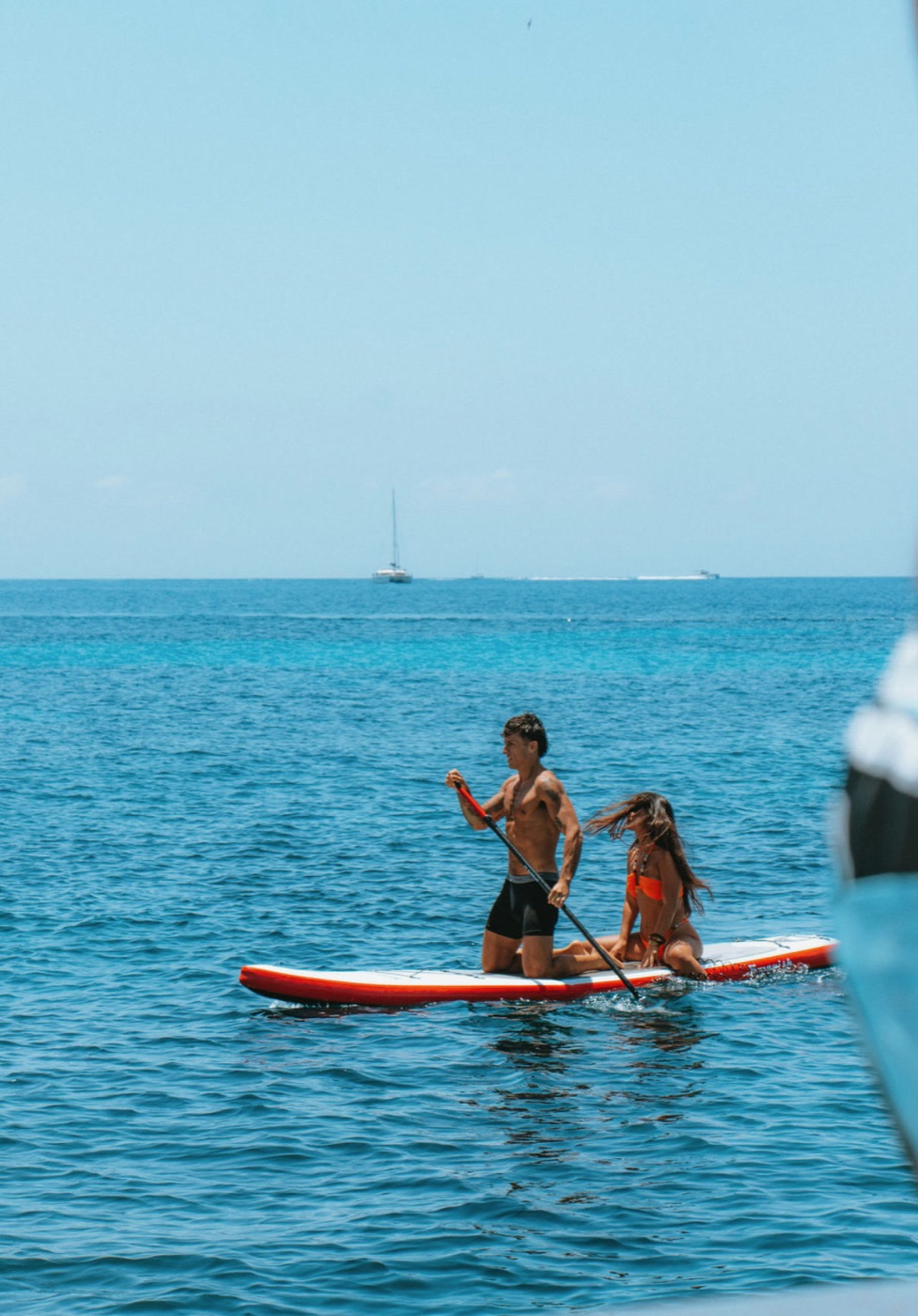 Kashi paddleboarding on open water